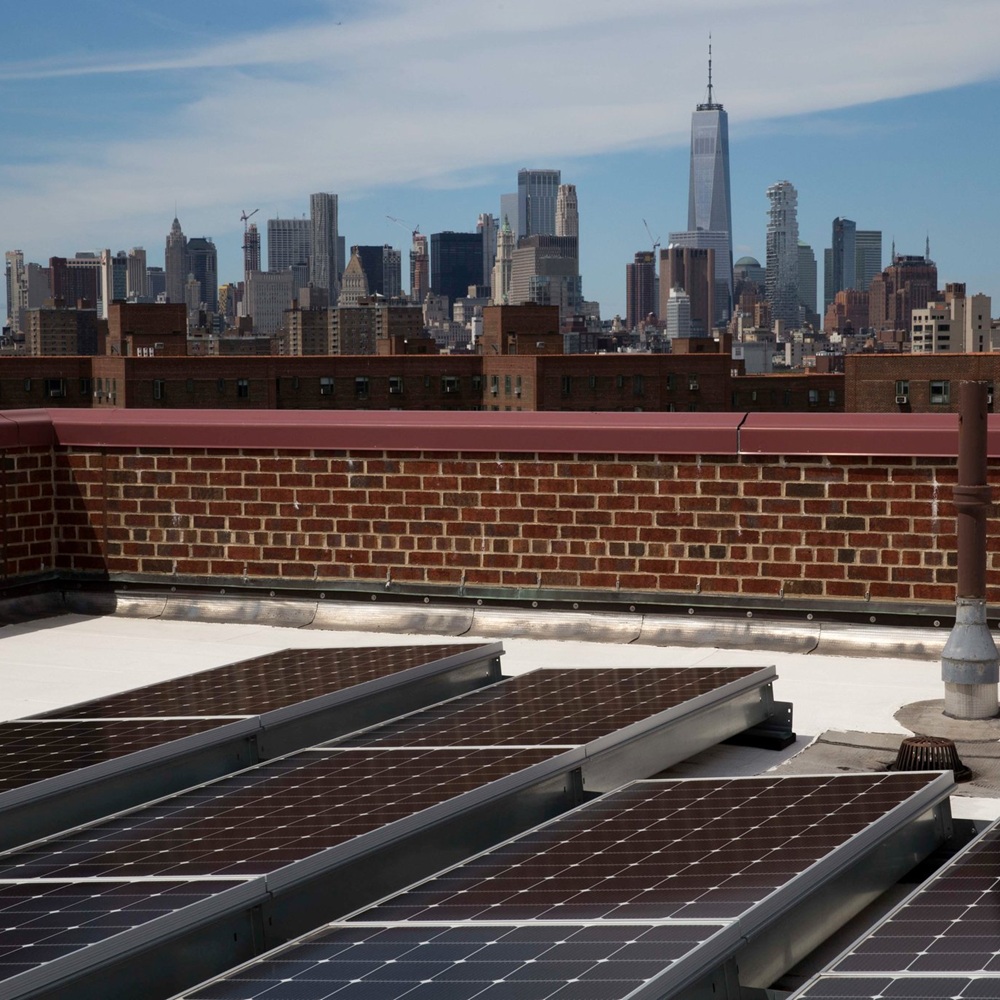 Americharge Energy technician expertly installing a state-of-the-art energy system in a New York building