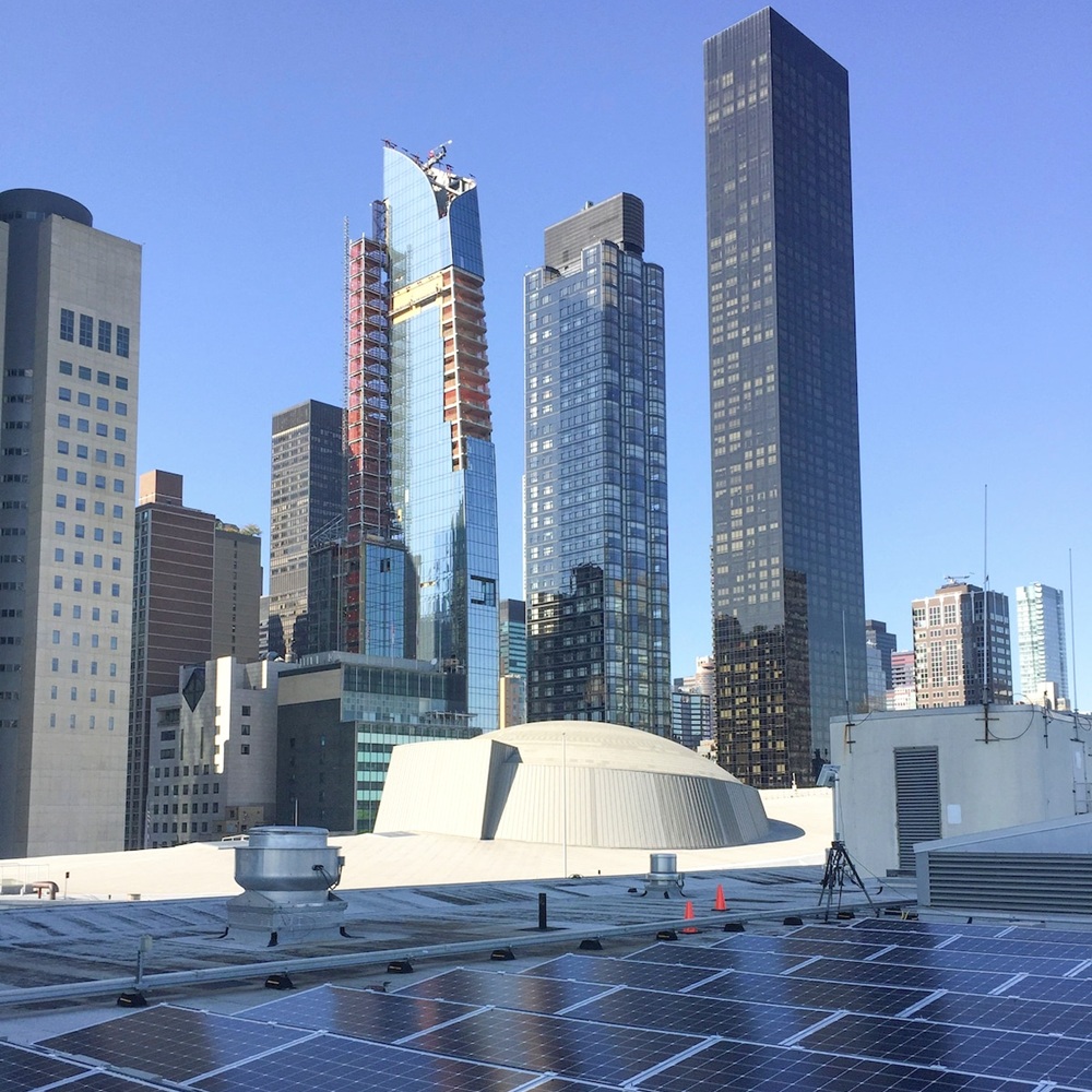 Americharge Energy technician expertly installing a state-of-the-art energy system in a New York building
